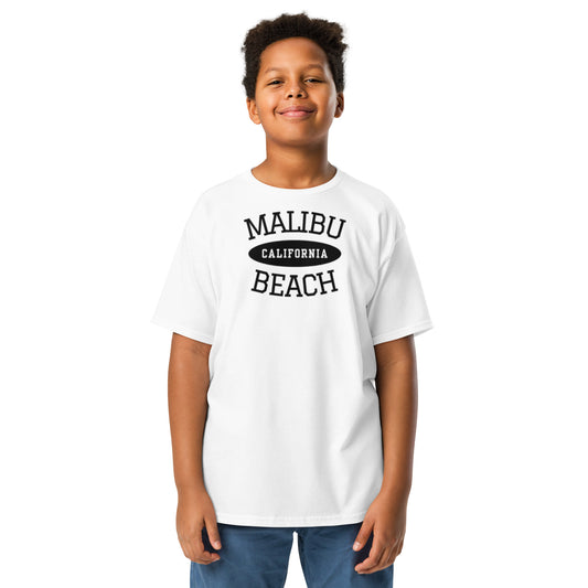 Child wearing a white t-shirt with 'Malibu California Beach' text on a white background